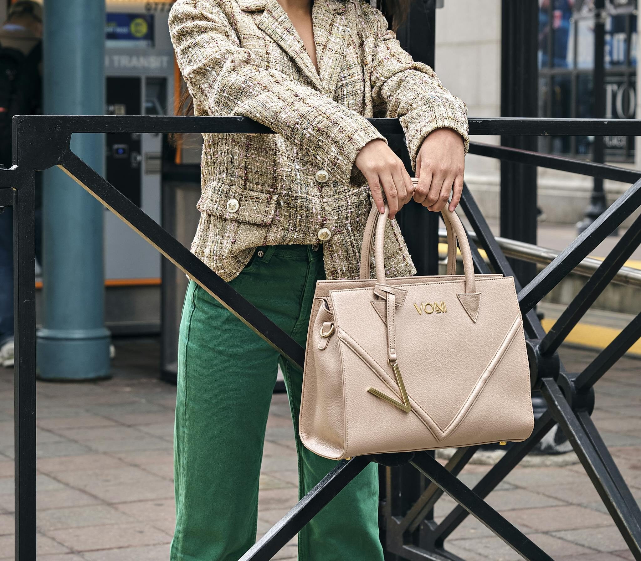 Attractive Brunette Girl Posing with Beige Leather Bag