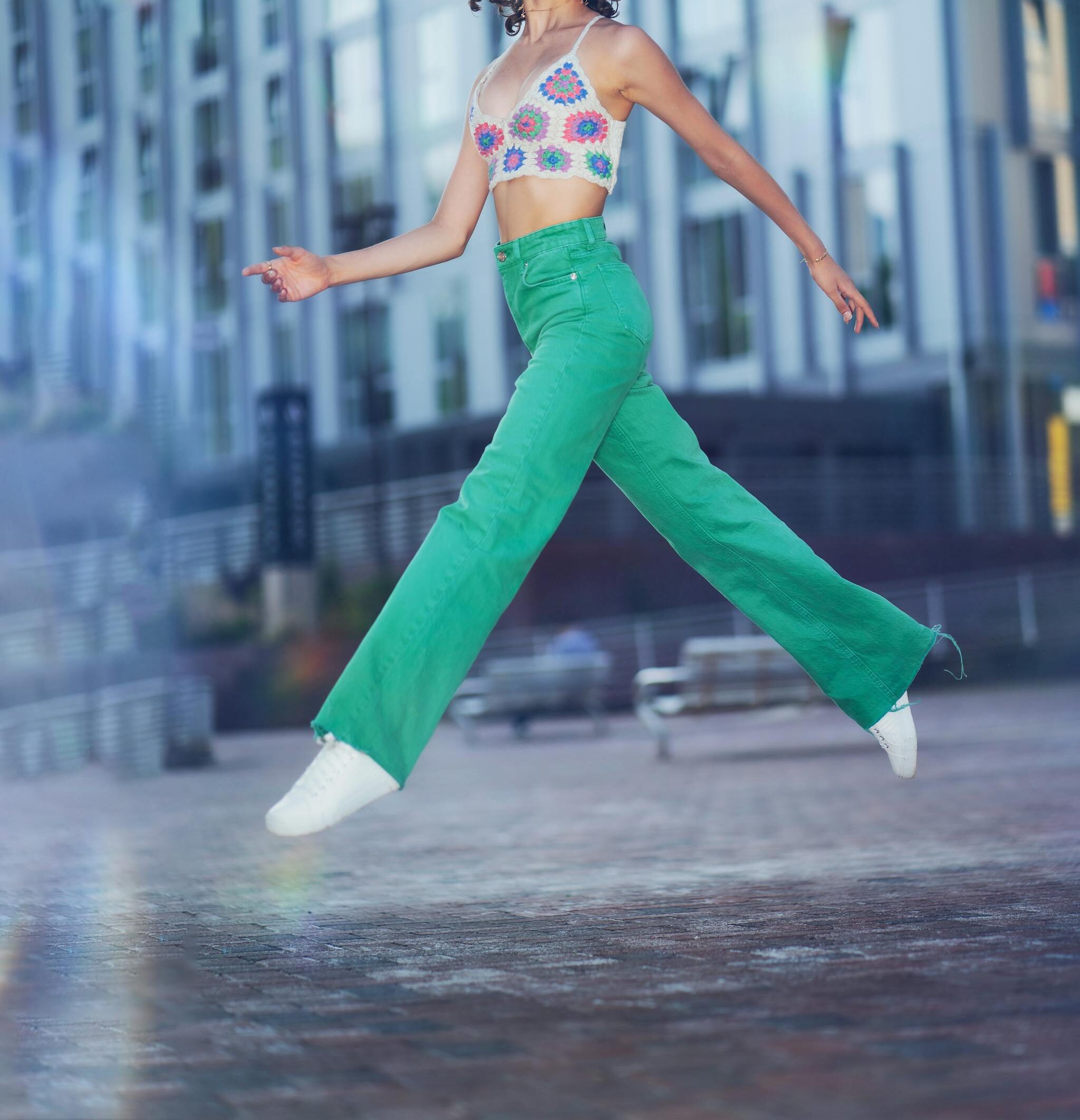 Woman Posing on a Square in Green Trousers